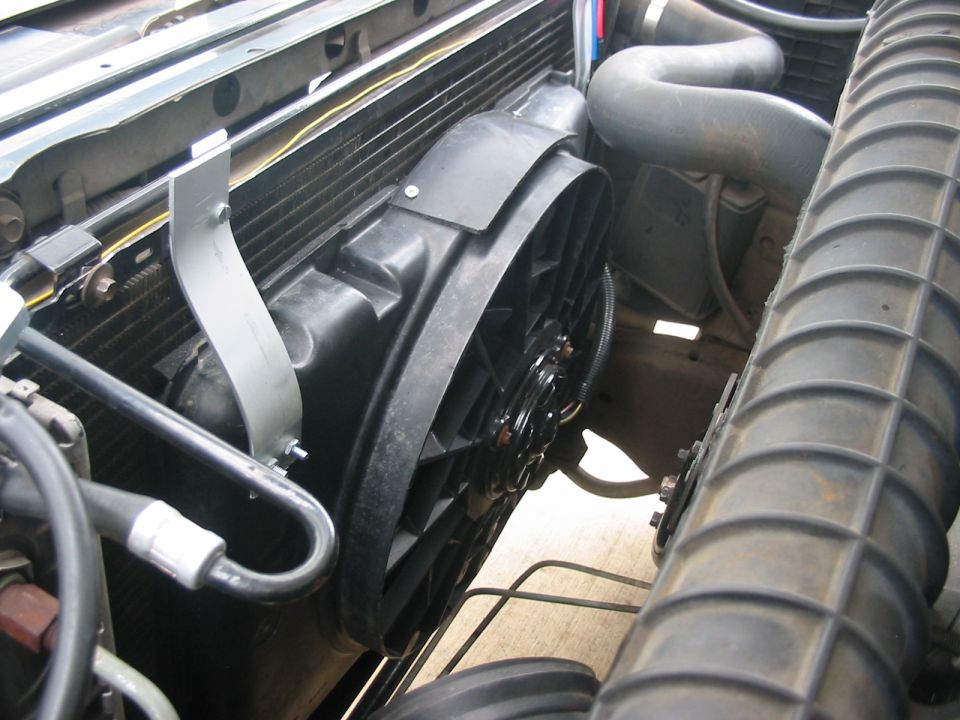 Electric cooling fan with black shroud mounted on radiator in Ford Bronco engine bay
