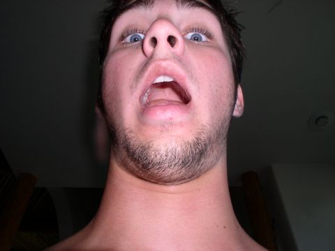 1990 Ford Bronco - A person's face is shown from a low angle, with a surprised expression.