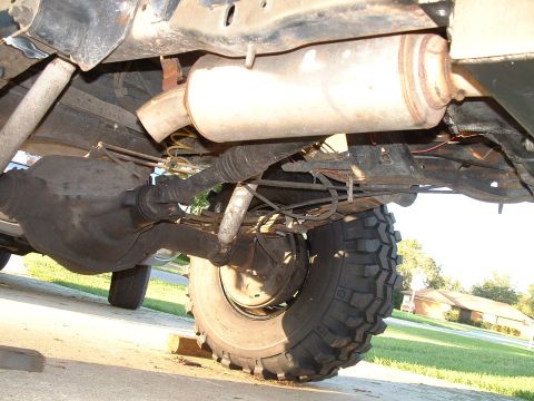 1995 Ford Bronco - Undercarriage view of a 1995 Ford Bronco, highlighting the rear axle and exhaust system.
