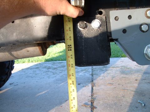 1995 Ford Bronco - A tape measure is used to measure the vehicle's frame, indicating a measurement around 25 inches.