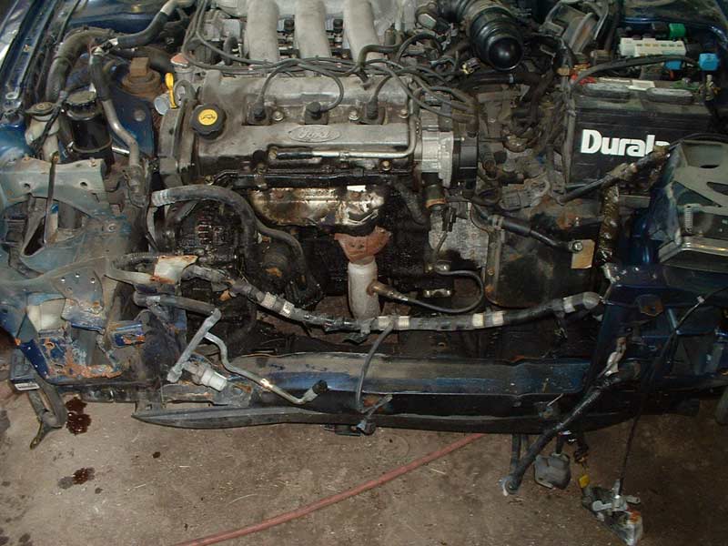 Engine bay with Ford branding on the engine block
