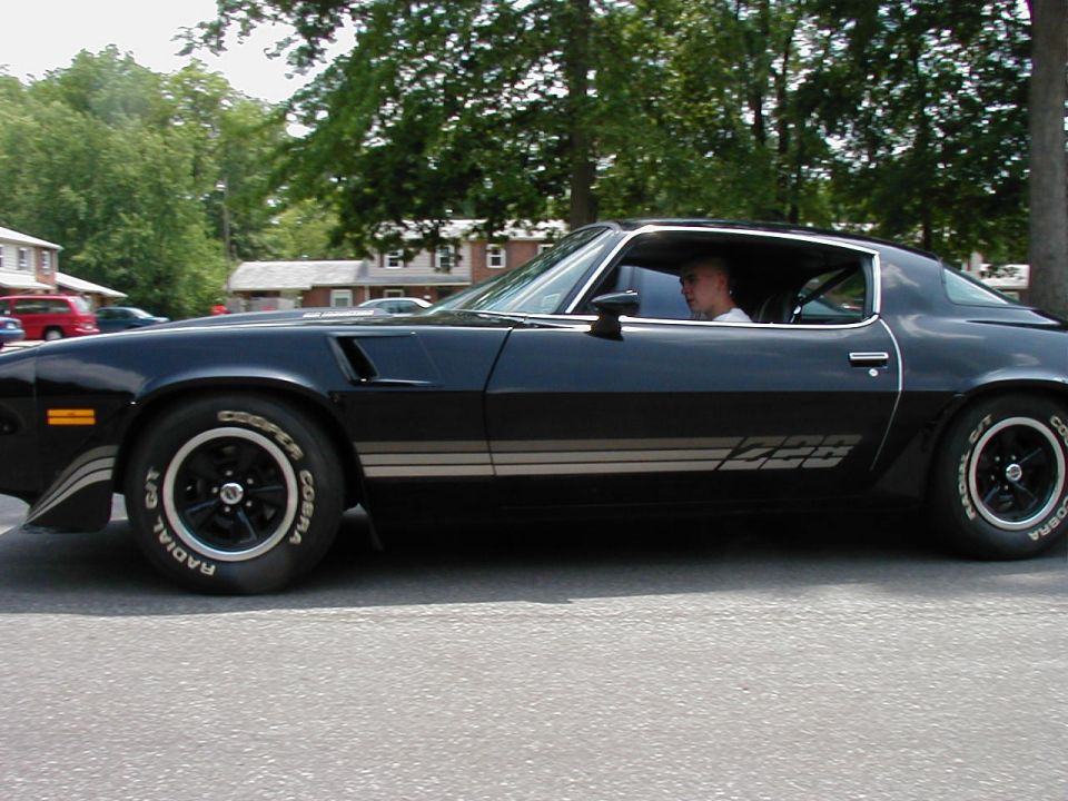 Black 1978 Chevrolet Camaro Z28 side view with Cooper Cobra tires