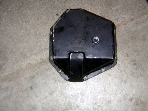 1995 Ford Bronco - The wanker previous owner before me decided to put the drain plug in the center of the cover, which in turn hits on the tierod horribly..