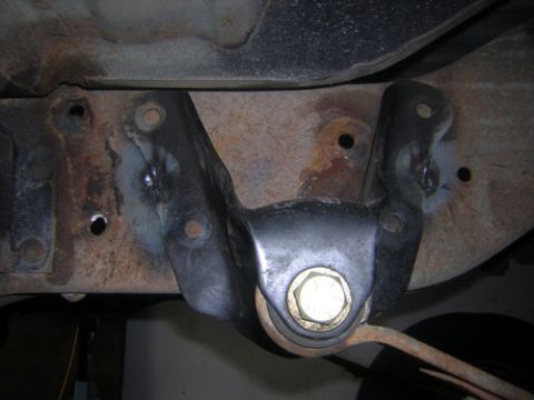 1995 Ford Bronco - Bracket tacked in place, comparison to stock holes