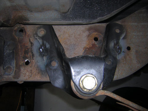 Bracket tacked in place, comparison to stock holes