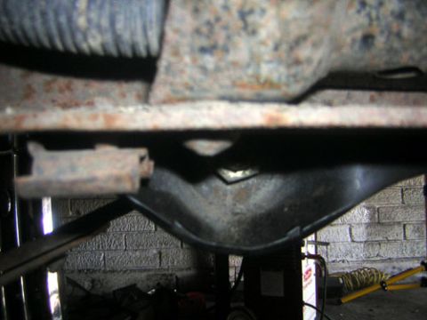 1995 Ford Bronco - Bracket in relation to stock crossmember rivet, and bottom of frame From frame to bottom of the bracket, is 1 7/8th"