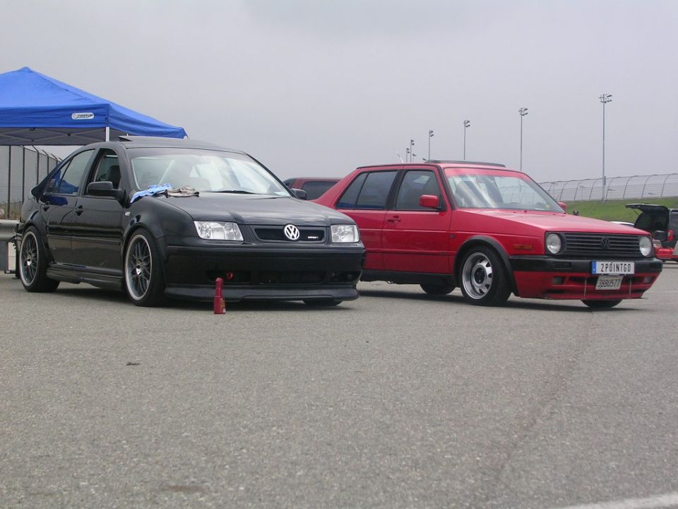 Red 1990 Volkswagen Golf GTI parked on asphalt