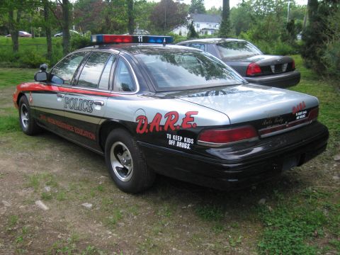 1991 Ford LTD Crown Victoria - This 1991 Ford Crown Victoria police car displays D.A.R.E. livery and is parked next to another similar vehicle.