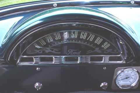 1956 Ford F-100 - Dashboard interior of a 1956 Ford F-100, showing the speedometer and an auxiliary RPM gauge.