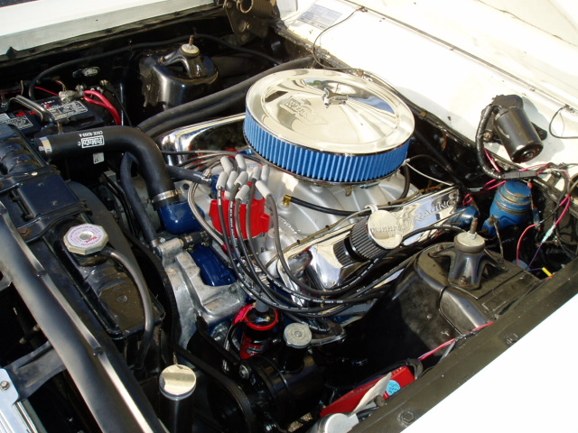 V8 engine bay with chrome air cleaner, blue filter and chrome valve covers