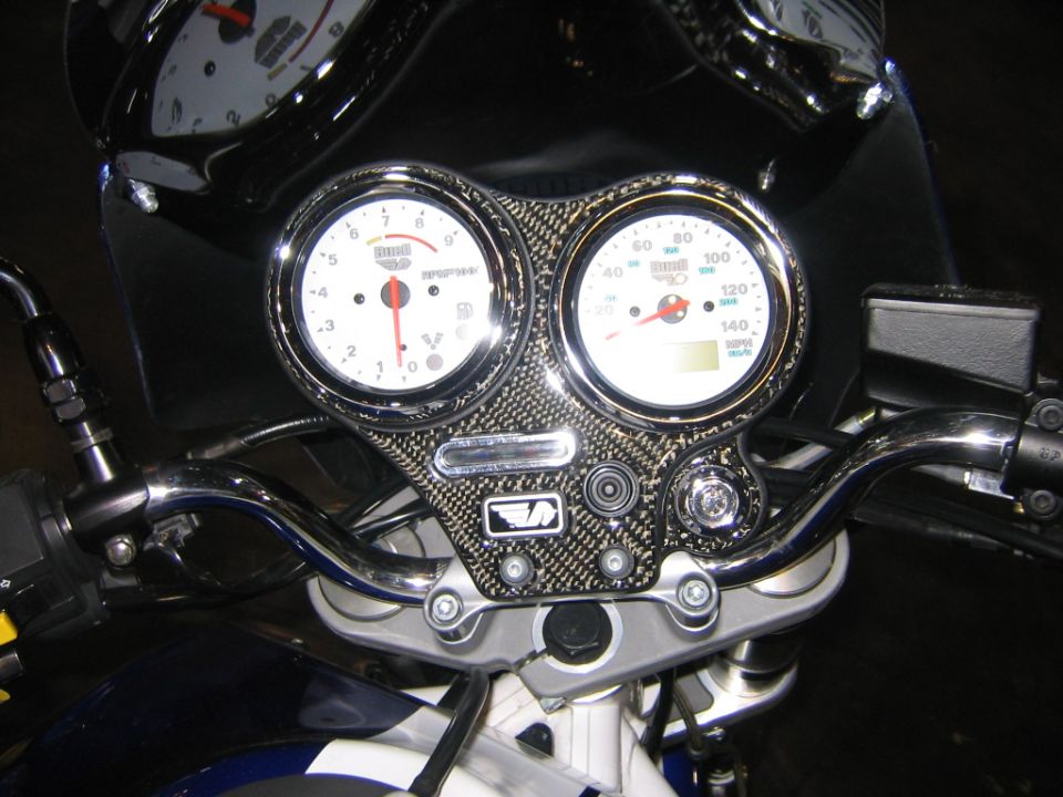 Buell motorcycle dual white gauges in carbon-fiber dash with chrome handlebars