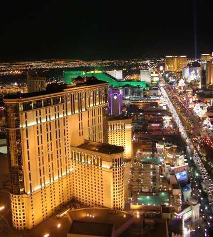 2002 Ford Mustang - A panoramic view of the Las Vegas Strip at night, the vibrant lights and bustling traffic.