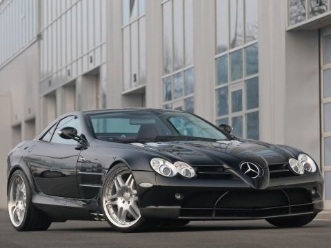 1990 Ford Bronco - A black Mercedes-Benz SLR McLaren is shown from a three-quarter front view.