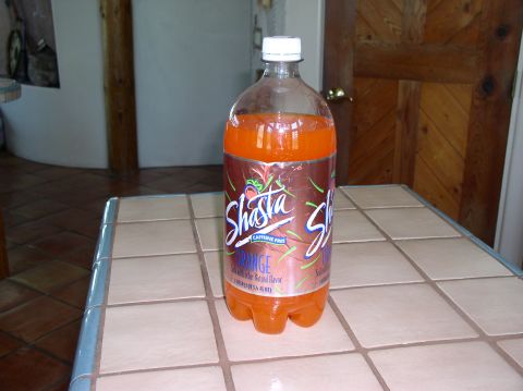 1990 Ford Bronco - A bottle of Shasta Orange soda sits on a tiled countertop.