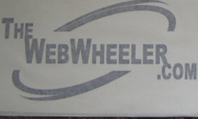 1990 Ford Bronco - Close-up of a single 'TheWebWheeler.com' logo design with a curved swoosh on a printed sheet.