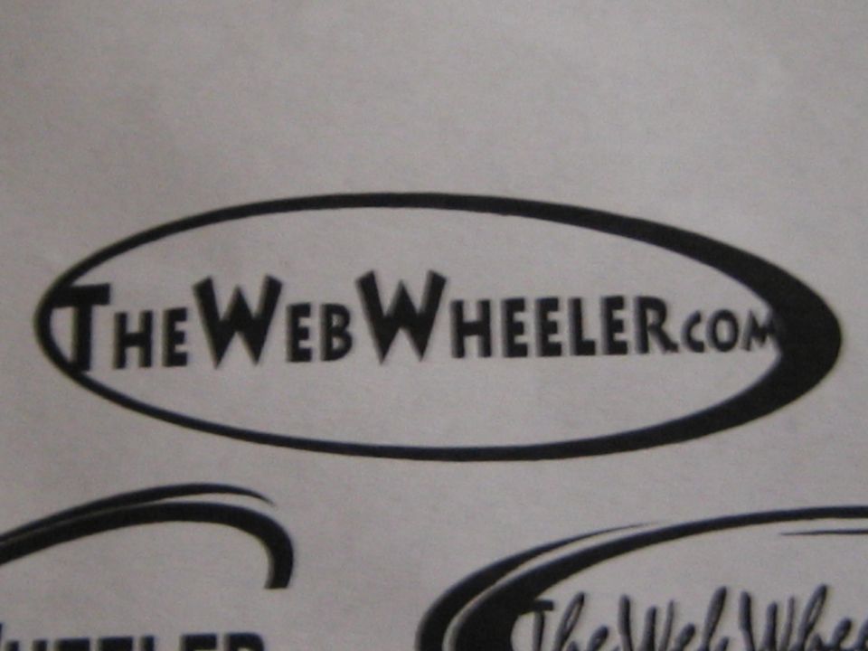 TheWebWheeler.com oval logo printed on paper