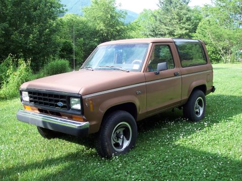1986 Ford Bronco II - This 1986 Ford Bronco II is shown in a three-quarter front view, parked outdoors on a sunny day.
