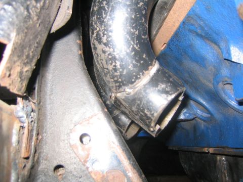 1978 Ford Bronco - Detail shot of exhaust piping and engine components, showing wear and tear.