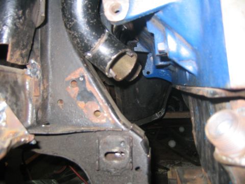 1978 Ford Bronco - Close-up view of engine bay components, including exhaust and painted parts.