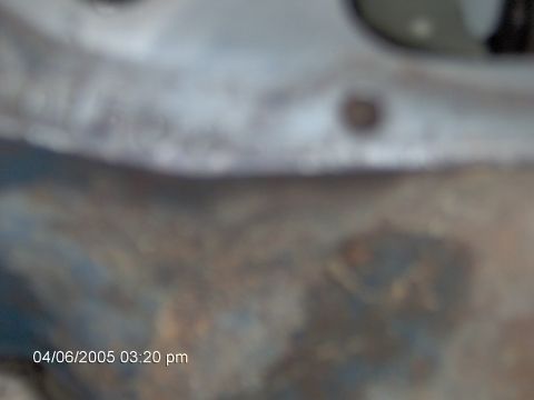 1978 Ford Bronco - Timestamp 04/06/2005 03:20 pm is visible on a close-up of a rusted metal surface.