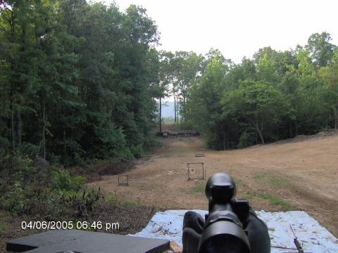 1978 Ford Bronco - A view down a shooting range with targets at various distances, framed by trees.