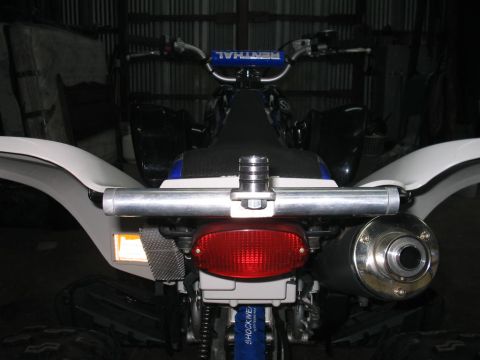 1991 Ford Bronco - Quad bike rear view showing exhaust, taillight, and handlebars. Album claims 1991 Ford Bronco.