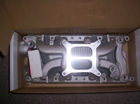 1989 Ford Bronco II - A new aluminum intake manifold is shown inside its shipping box.