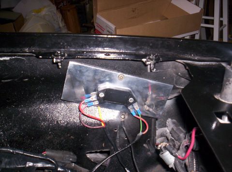 1989 Ford Bronco II - Close-up view of an aftermarket electrical component installed in a vehicle's engine bay.