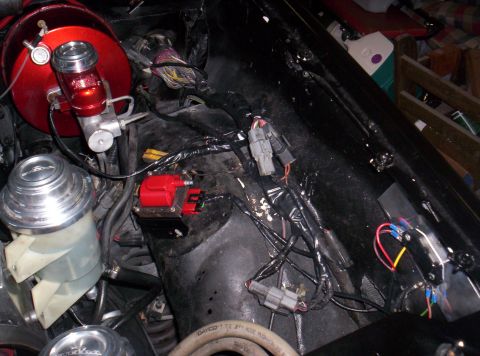 1989 Ford Bronco II - Engine bay components including a red brake booster and ignition coil are visible.