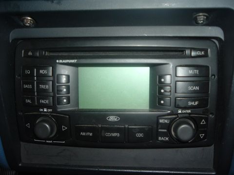 1993 Ford Taurus - Interior view of a car's Blaupunkt stereo system, Ford branding and various control buttons.