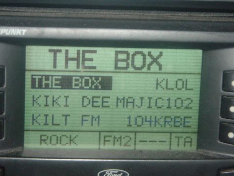 1993 Ford Taurus - The car's radio display shows several preset stations, including 'THE BOX' and 'MAJIC102'.