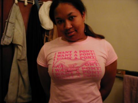 1997 Ford Taurus - Woman wearing a pink t-shirt with a horse graphic and text.