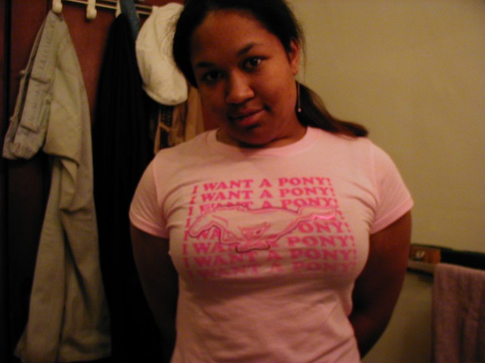 Woman in pink t-shirt with 'I Want a Pony!' text and a horse graphic