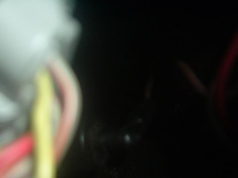 1993 Ford Taurus - A tangle of wires is visible in this close-up shot, with a website address at the bottom right.