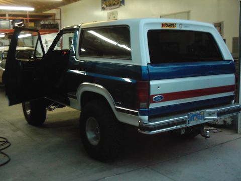 1978 Ford Bronco - This Ford Bronco is parked inside a garage with its driver's door ajar.