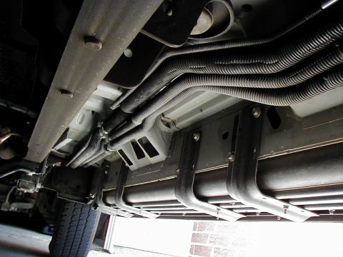 2002 Ford Excursion - There's about 4 mounting clamps holding up the 4 lines to the bottom of the truck body which will have to be dropped in order to remove the…