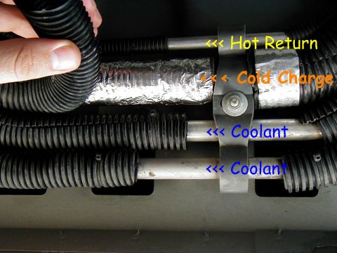 2002 Ford Excursion - On the cold charge line remove the plastic wire loom covering then remove the very thin cheepo insulation,set aside the wire loom covering.