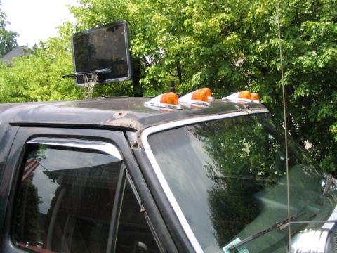1986 Ford F-150 - This 1986 Ford F-150 has amber cab lights and a custom basketball hoop attached to the roof.