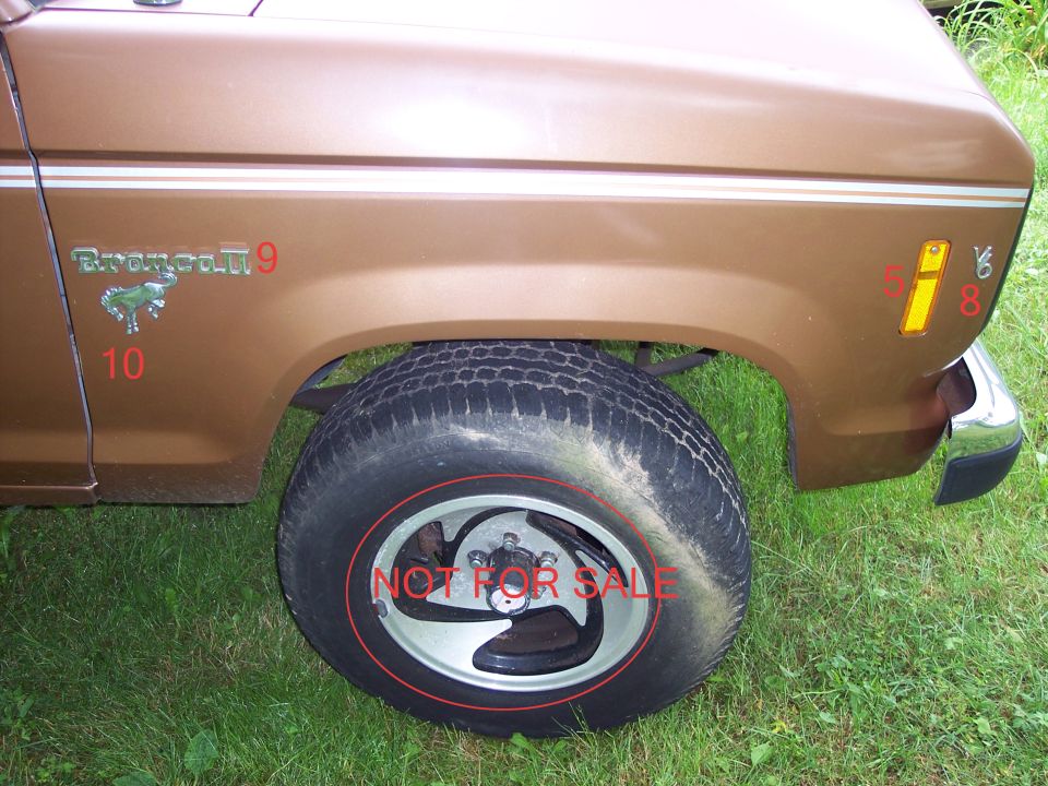 1986 Ford Bronco II side view showing fender, wheel, and 'Bronco II' badge