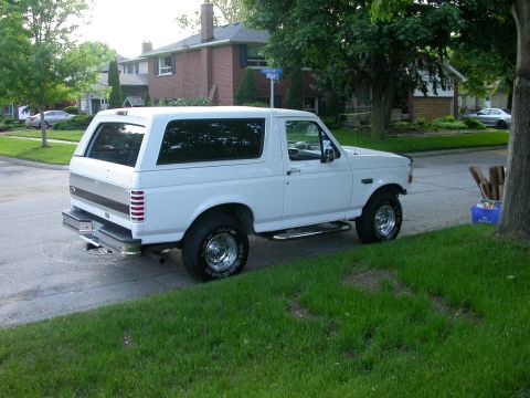 1996 Ford Bronco - Next is a 4" lift with super runner steering, 35 x 12.50 tires, 456 gears, ARB air locker in the rear, and a Warn winch & bumper set.