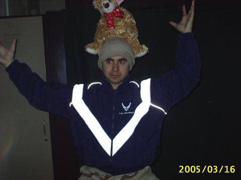 1988 Mercury Sable - Person in U.S. Air Force jacket and beanie with a teddy bear on head, arms raised.