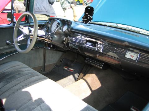 1985 Ford Mustang - Interior view of a classic car, a distinctive dashboard and seating.