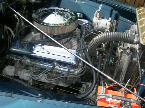 1956 Ford F-100 - Close-up of a Ford V8 engine, showing valve covers and air intake system.
