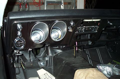 1968 Chevrolet Camaro - The interior of a 1968 Chevrolet Camaro shows the dashboard with its distinctive dual gauge pods and center-mounted radio.