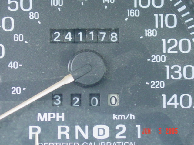 Speedometer close-up with odometer showing 241,178 miles and trip meter at 320.0