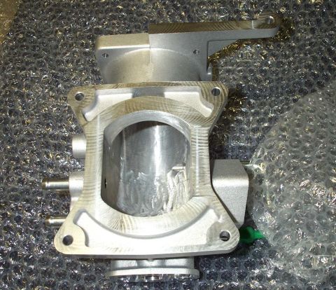 1998 Ford Crown Victoria - A close-up view of a ported upper plenum part, with a Supermotors.net watermark visible.