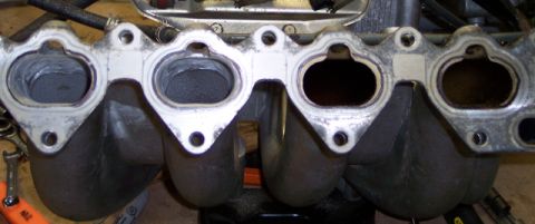 1999 Mitsubishi Mirage - Close-up of an intake manifold, likely removed for service or modification.