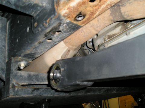 1993 Ford Bronco - Close-up of the vehicle's undercarriage, focusing on the frame and suspension parts.