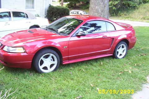 2000 Ford Mustang - side shot of the car bone stock