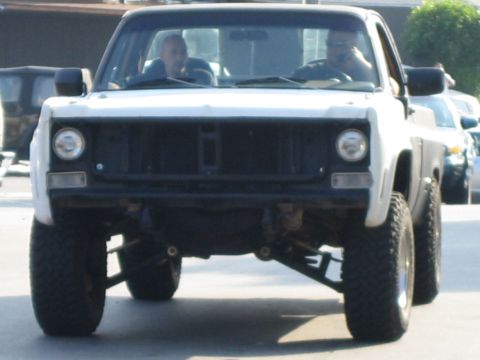 1985 Ford Mustang - This lifted pickup truck has a front end that does not match the claimed 1985 Ford Mustang.